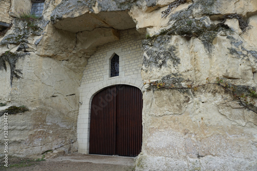 old wooden door entrance to a troglodyte cave in the Loire valley, France