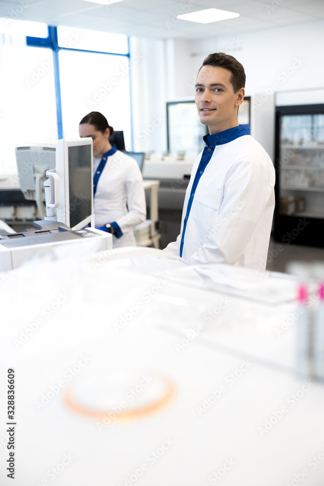 Scientists using modern lab equipment at work Scientists using modern lab equipment at work