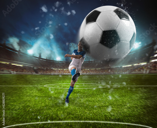 Football scene at night match with player in a white and blue uniform kicking the ball with power © alphaspirit