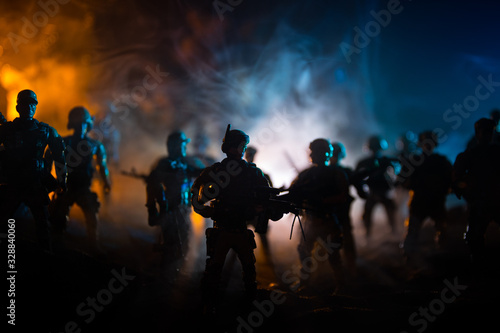 War Concept. Military silhouettes fighting scene on war fog sky background, World War Soldiers Silhouette Below Cloudy Skyline At night.