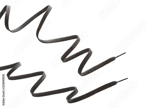 two long black zigzag shoelaces isolated on white background photo