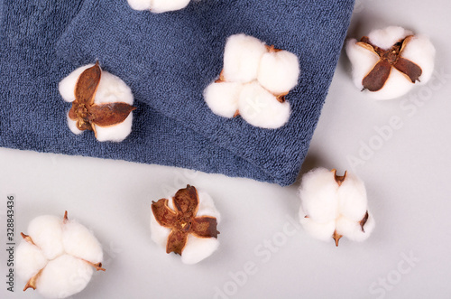 Spa concept idea  cotton and towel composition on grey background.