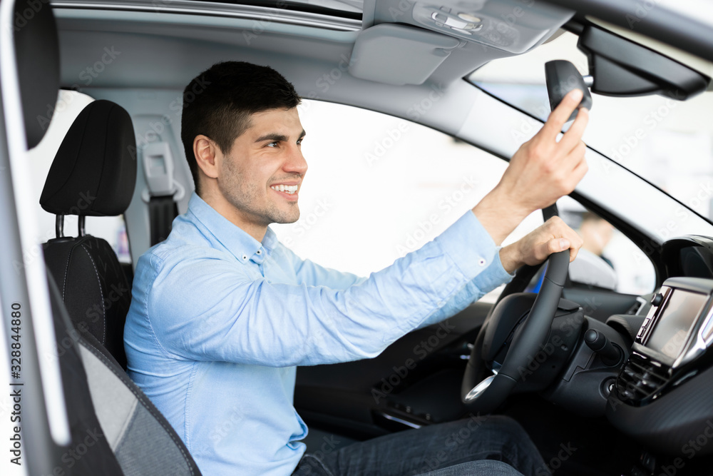 Guy Checking Mirrors Sitting In Driver's Seat Guy Checking Mirrors Sitting In Driver's Seat