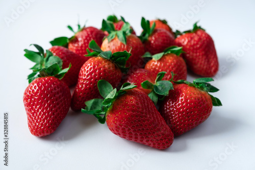 Strawberries with strawberry leaf on white background