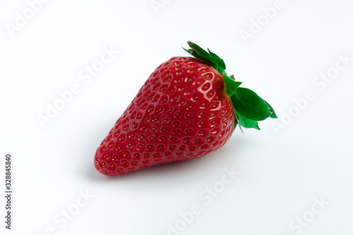Strawberry with strawberry leaf on white background