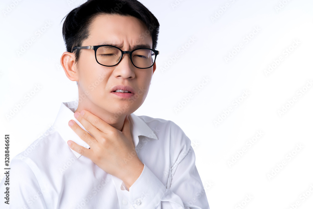 sick asian glasses male adult sore throat pain hand touch neck with stressful and tension white background health ideas concept sick asian glasses male adult sore throat pain hand touch neck with stressful and tension white background health ideas concept
