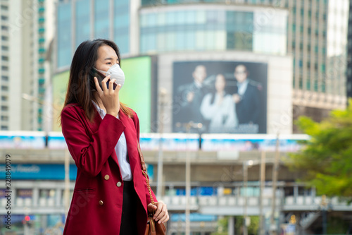 Asian girl use a protection mask for prevent PM 2.5 and corona viruus or covic 19