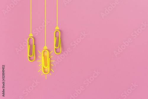 Great ideas concept with paperclip,thinking,creativity,light bulb on blue background,new ideas concept.