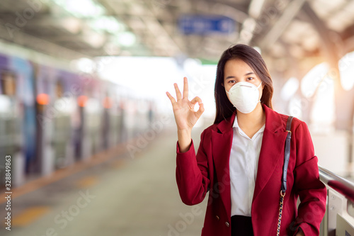Asian girl use a protection mask for prevent PM 2.5 and corona viruus or covic 19 © anekoho