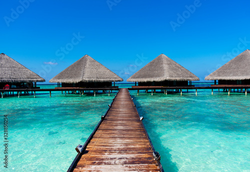 Maldives, Kaafu atoll - December 27 2019 - The wooden pier to the water villas