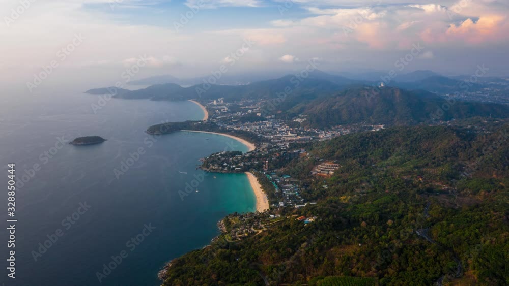 Aerial timelapse of the coast of Phuket island in Thailand. Flight over the beaches of Kata Noi, Kata and Karon during the evening with clouds in the sky. Timelapse of the tropical island of Phuket Aerial timelapse of the coast of Phuket island in Thailand. Flight over the beaches of Kata Noi, Kata and Karon during the evening with clouds in the sky. Timelapse of the tropical island of Phuket