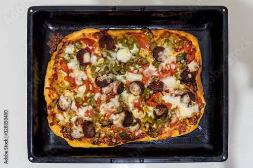 Homemade crispy dough with pizza vegetables.