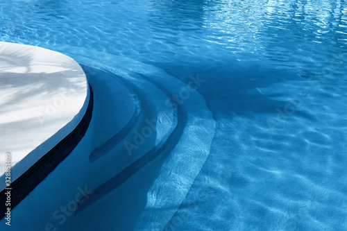 Blue water in swimming pool at summer vacation