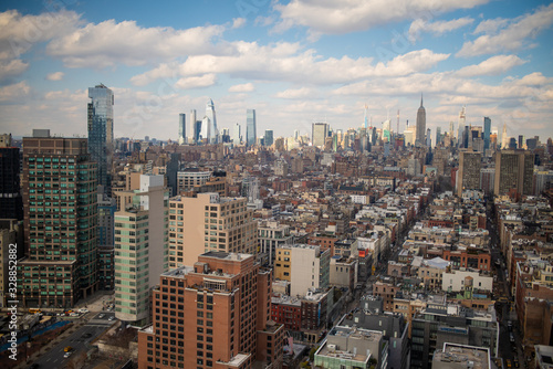  Landscape shot of buildings in New York with clouds hovering above