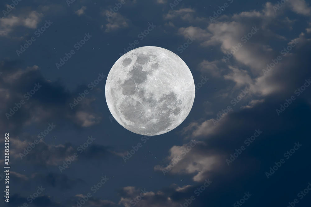 Full moon and blurred cloud on blue sky.