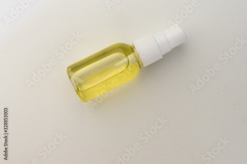 selective focus, plastic spray jar with cosmetic oil