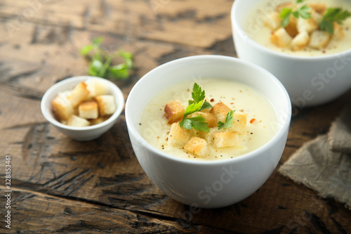 Homemade cheese soup with bread croutons