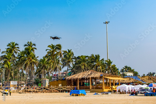 Drone flies over the beach