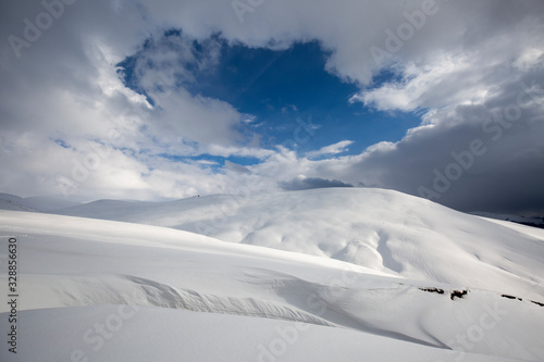 snowy mountain and cloudy blue sky in rize turkey