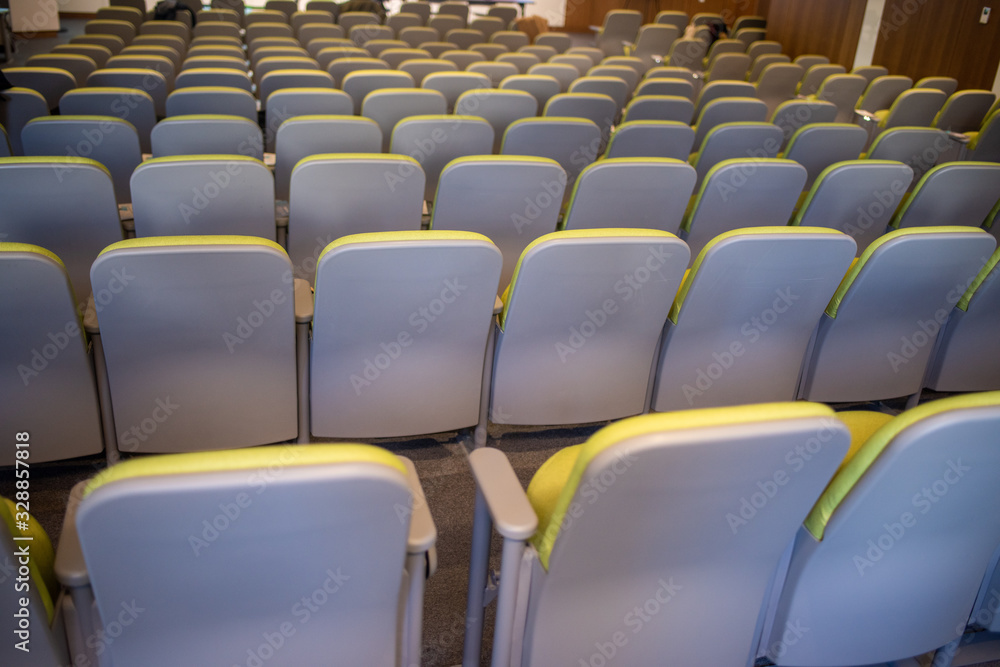 Fototapeta premium Assortment of chairs stacked in a row