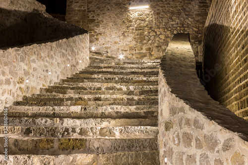 Slika na platnu Inside view of the beautifully lit ancient fortress with reconstructed walls and