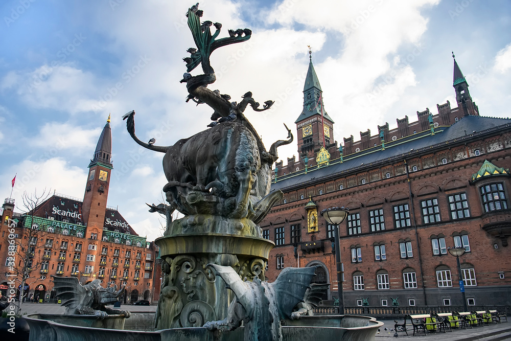 Fountain with bronze sculpture of bull and dragon on City Hall Square in Copenhagen, Denmark. February 2020