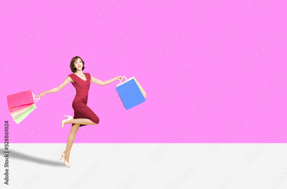happy young womanl holding shopping bags and running happy young womanl holding shopping bags and running
