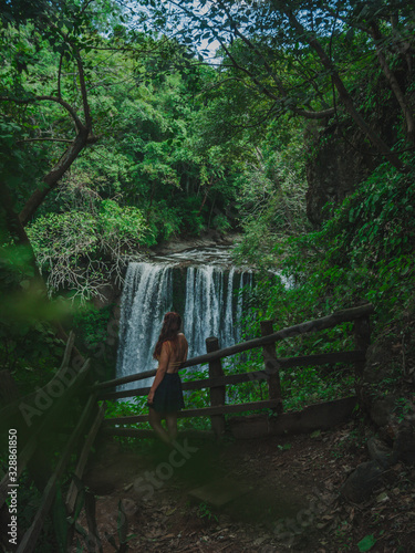 Woman looking at the waterfall