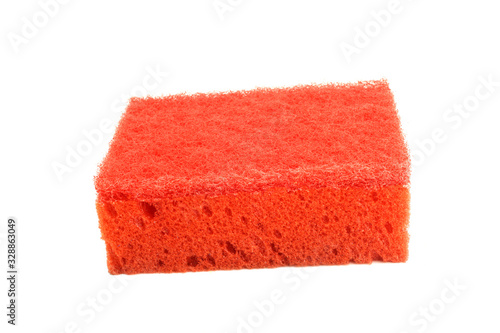 Red kitchen sponge for dishes, household cleaning is isolated on white background.