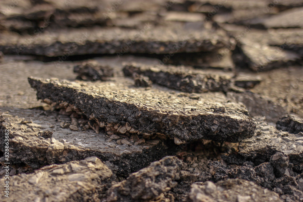 Pieces of Broken asphalt. Dismantling road surface Pieces of Broken asphalt. Dismantling road surface