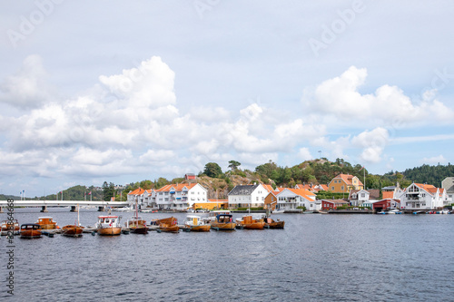 White house and old wooden boats in Mandal, Southern Norway  © Gunnar E Nilsen