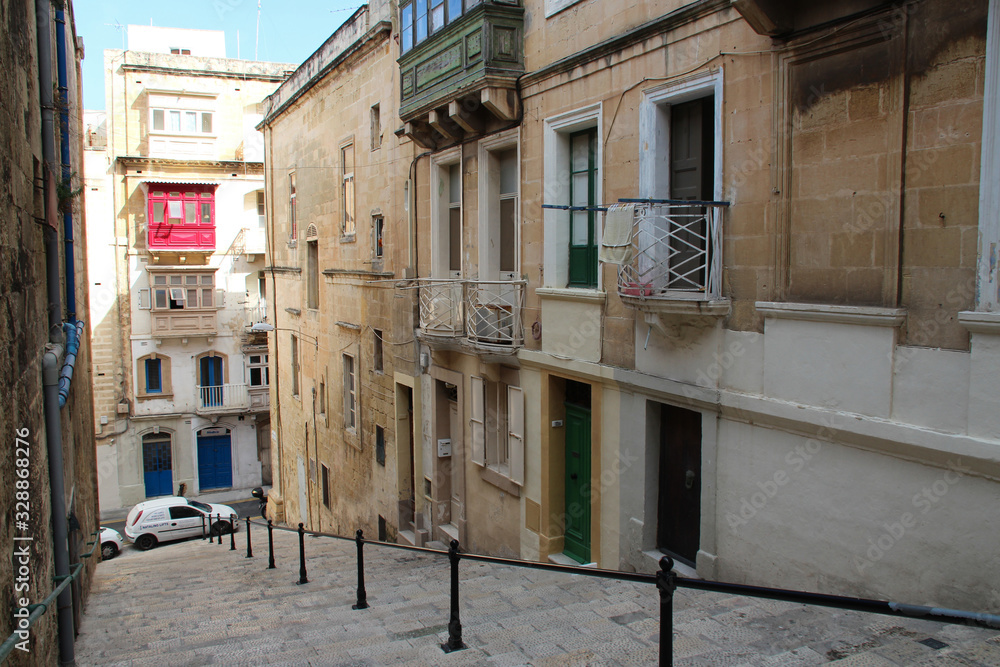 street, stairs and flats buildings in valletta (malta)