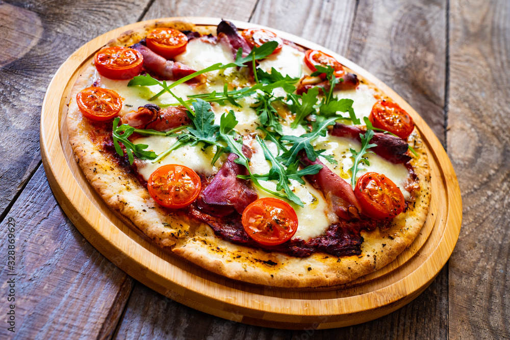 Margherita pizza on wooden table