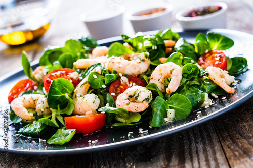 Prawn salad on wooden table