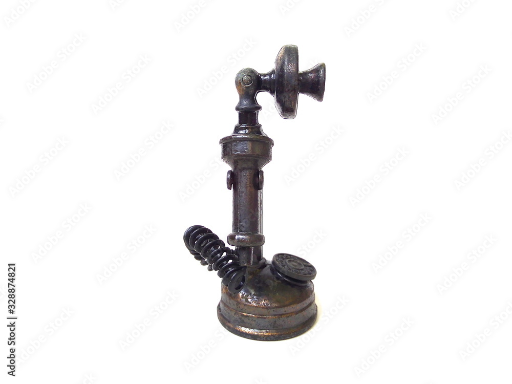 Close up of antique telephone toy isolated on white background. Kids toy. Metal phone toy. Close up of antique telephone toy isolated on white background. Kids toy. Metal phone toy.