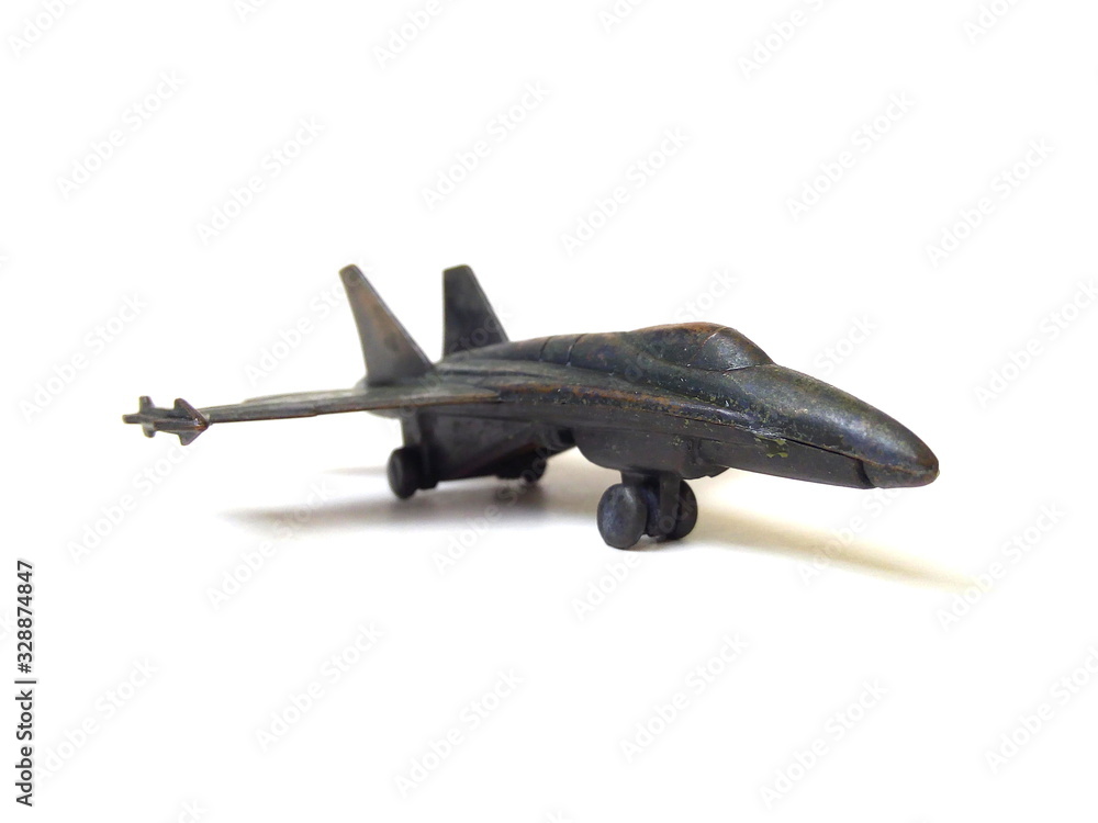Close up of military aircraft toy isolated on white background. Kids toy. Metal toy. Close up of military aircraft toy isolated on white background. Kids toy. Metal toy.