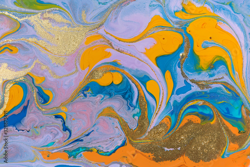 Blue and orange marbling liquid background. Fluid art abstract texture. Mixed acrylic inks.
