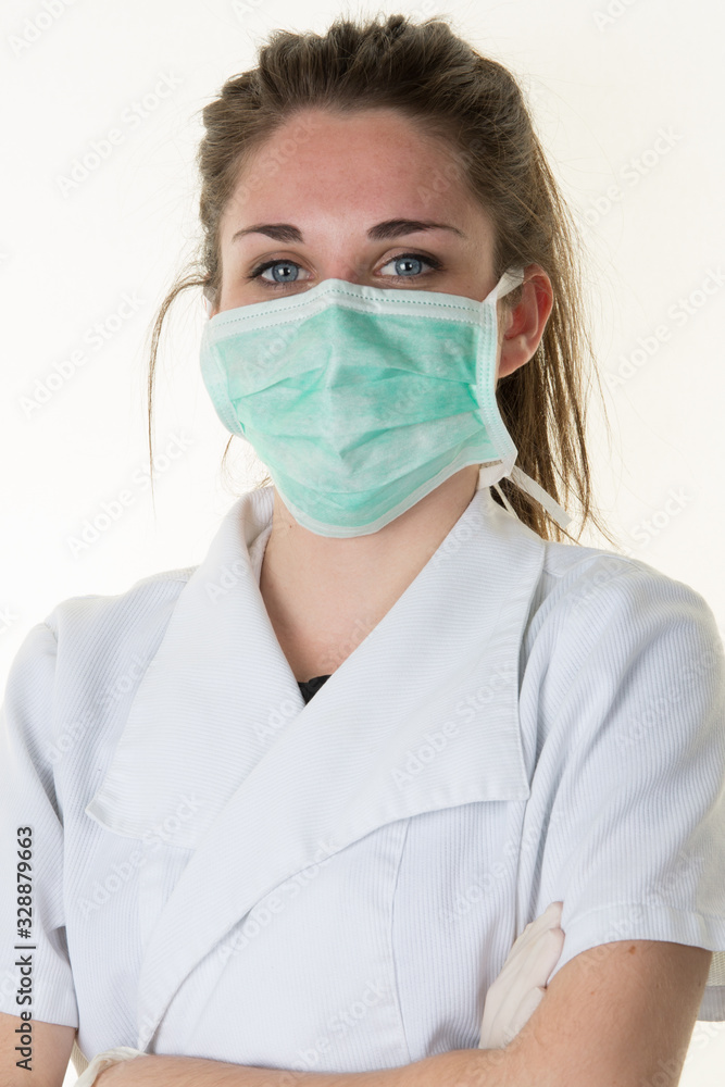 Woman nurse arms crossed with protective face mask COVID-19 coronavirus epidemic Woman nurse arms crossed with protective face mask COVID-19 coronavirus epidemic