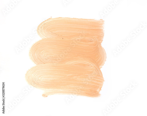 Bronze makeup smear isolated on white background. Liquid foundation makeup texture. Foundation strokes or liquid powder on a white background.