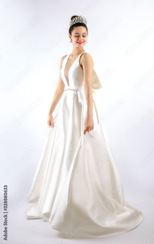 Beautiful woman brunette hair perfect skinny body wear fashion long dress for party wedding dress bride natural model with natural makeup style for celebrity and red carpet gray background. Isolated Beautiful woman brunette hair perfect skinny body wear fashion long dress for party wedding dress bride natural model with natural makeup style for celebrity and red carpet gray background. Isolated
