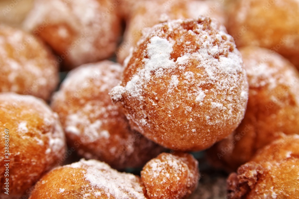 Croatian fritters close up. Traditional fried pastry, crispy from the outside, soft from the inside. Delicious snack.