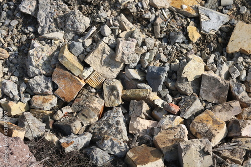 Construction waste with elements of and destroyed old structures at municipal landfill