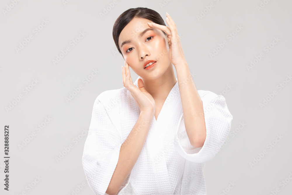 Beautiful Asian young woman touching soft cheek smile with clean fresh skin Happiness and cheerful with positive emotional,isolated on white background,Beauty Cosmetics and Facial treatment Concept Beautiful Asian young woman touching soft cheek smile with clean fresh skin Happiness and cheerful with positive emotional,isolated on white background,Beauty Cosmetics and Facial treatment Concept