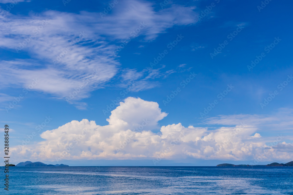 Blue sky with white cloud  and deep blue sea