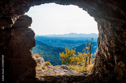 cave windows with mountain landscape view