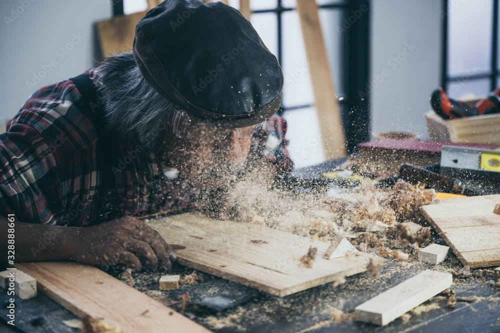 old carpenter man, wooden craftsman working with wood old carpenter man, wooden craftsman working with wood