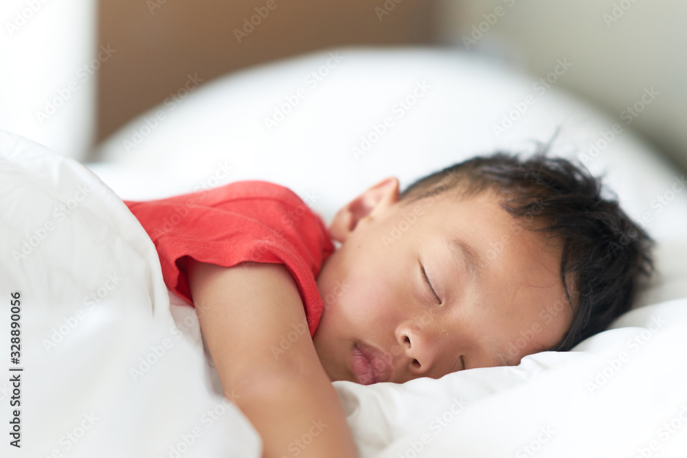 asian boy sleep or nap on comfortable pillow and bed in deep sleep asian boy sleep or nap on comfortable pillow and bed in deep sleep
