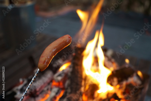 Baking sausages on a bonfire outdoors