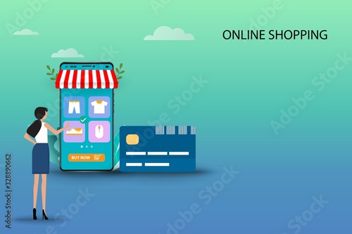 Fototapeta Naklejka Na Ścianę i Meble -  Business concept of online shopping, young woman is standing in front of credit card and smartphone that the display contain list of products to find a new pant in blue green shade color background.