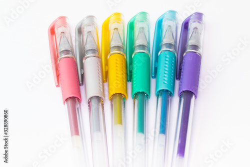 Set of color plastic gel pens with metallic colors  isolated on white background